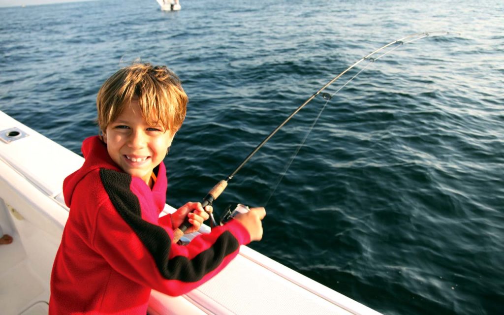 https://carefreeboats.com/wp-content/uploads/2014/12/Child-fishing-on-boat.jpg